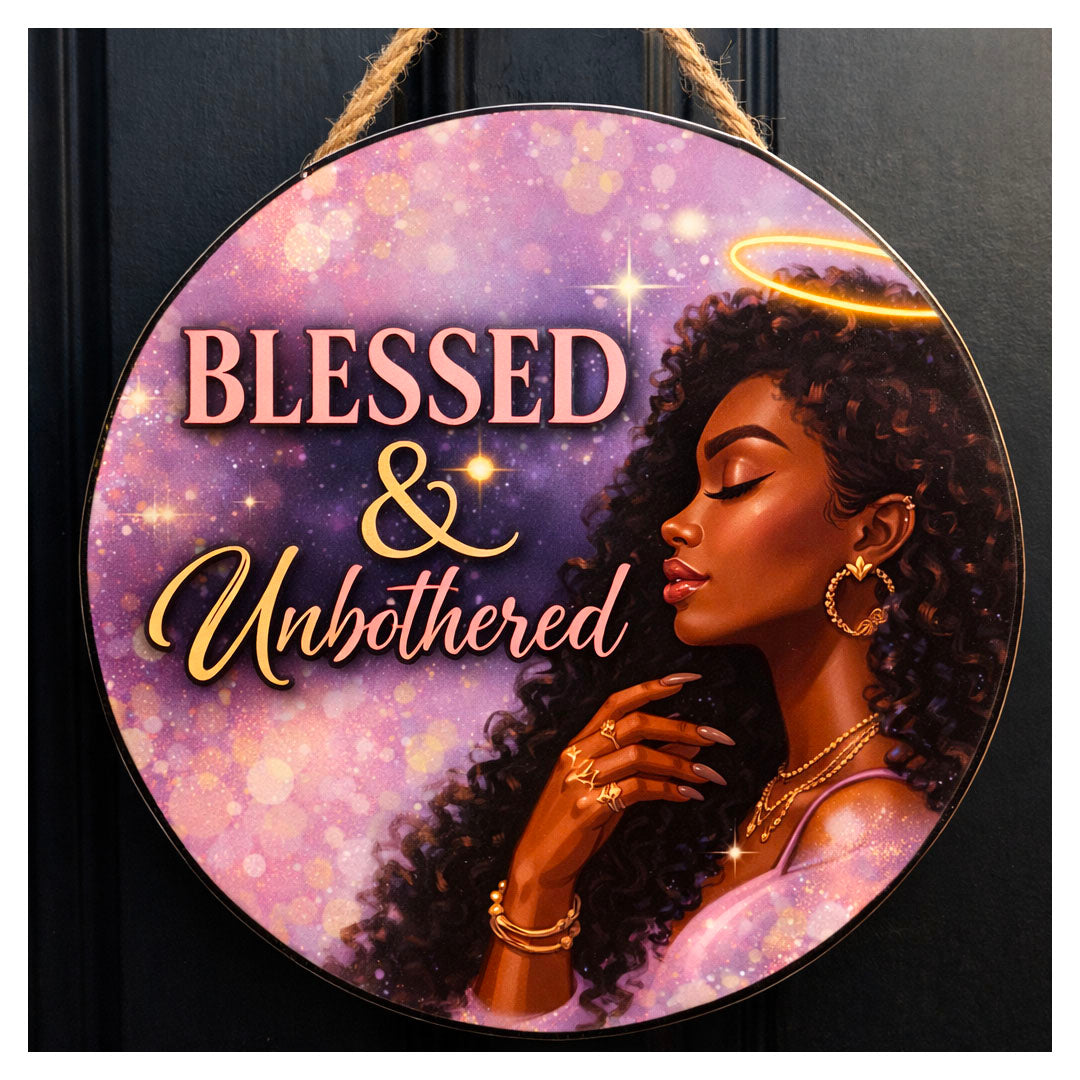 Decorative sign with a woman's face and 'Blessed & Unbothered' text on a purple background. 12 inch Blessed and Unbothered inspirational wall art sign featuring glam illustration and bold gold typography from the Alignment Series Drop 001
