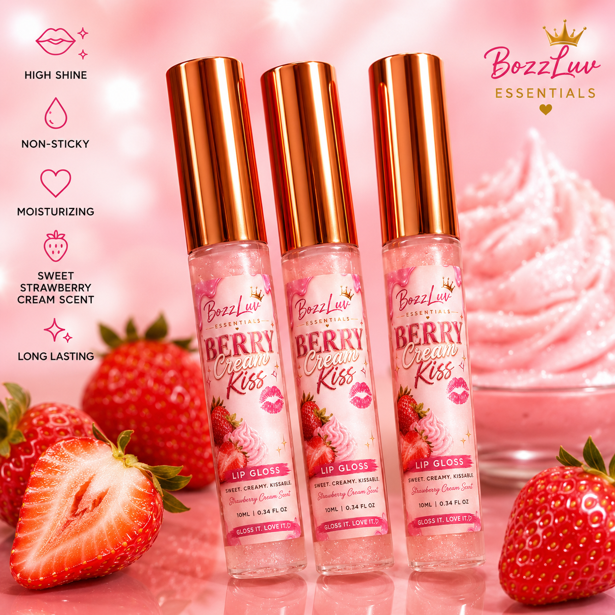Berry Cream Kiss Lip Gloss by BozzLuv Essentials in clear pink gloss tubes with rose gold caps, displayed with strawberries and whipped cream on a soft pink background.