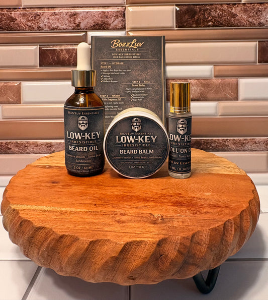 Low-Key Irresistible Beard Care Kit by BozzLuv Essentials including beard oil, beard balm, and roll-on fragrance. 